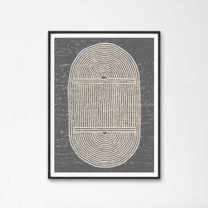 May include: Framed abstract art print featuring a beige and gray design. The artwork has a textured, distressed appearance. The central design is an oval shape composed of concentric lines, with vertical lines in the center.
