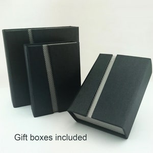 Dark grey, magnetic gift box included with your pendant.
