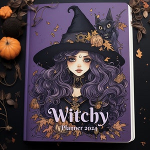 May include: A purple Witchy Planner 2024 with a witch illustration on the cover. The witch has long purple hair, a black hat, and is surrounded by autumn leaves. A black cat is perched on her shoulder. The planner is open.