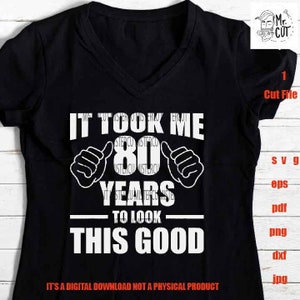 May include: Black t-shirt with white text that reads "It took me 80 years to look this good".