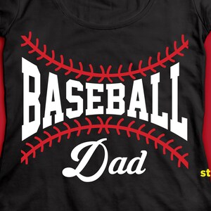 May include: Black t-shirt with a white baseball graphic and the text "Baseball Dad" in a white cursive font.