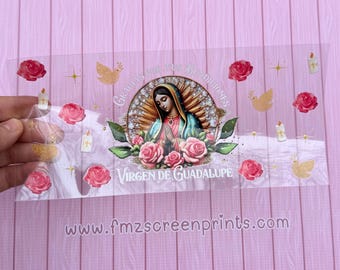 May include: A clear vinyl sticker with a colorful image of the Virgin Mary, surrounded by roses and a dove. The text "Gracias por tus Bendiciones Virgen de Guadalupe" is printed on the sticker.