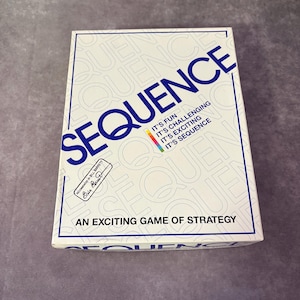 May include: A white board game box with the word "SEQUENCE" in large blue letters. The box also has the text "IT'S FUN, IT'S CHALLENGING, IT'S EXCITING, IT'S SEQUENCE" in a colorful design. The box reads "AN EXCITING GAME OF STRATEGY".