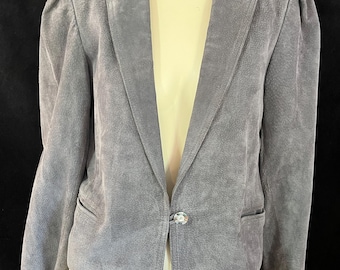 May include: A gray suede blazer with a single button closure and a slightly cropped length.