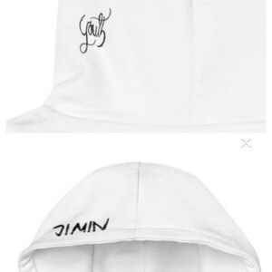 May include: White hoodie with the word "Youth" in cursive script on the upper left side. The word "JIMIN" is printed in black capital letters on the hood. The hoodie is made of a soft, comfortable material.