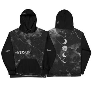 May include: Black hoodie with a marble-like pattern and the word "NEVERMIND" in white. The sleeves are solid black, with the words "FOREVER" and "YOUNG" on the sleeves. The back features a moon phase design.