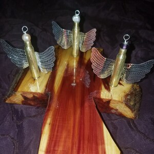 Angel 223 casing I can drill hole in neck to be hung or not and it's a desk Angel comes with different bead head