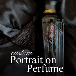 May include: Black perfume bottle with a custom portrait of a woman. The bottle has a black cap with a gold band and a black tassel. The text "custom Portrait on Perfume" is visible.