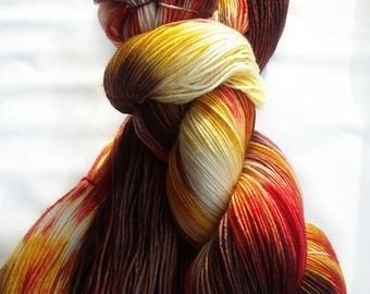 Hand dyed sock yarn, sorcery, 75/25, super wash merino wool, nylon yarn, fingering weight yarn, black yarn, yellow yarn, white yarn