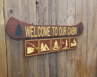 Welcome to our Cabin/Rustic/Carved/Wood/Canoe/Sign/Fishing/Camping/Campfire/Icons/Recreational/Décor