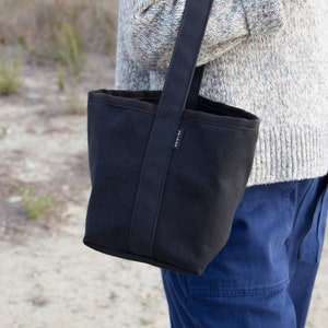 Reversible Small bucket style black canvas tote bag, 6 pockets