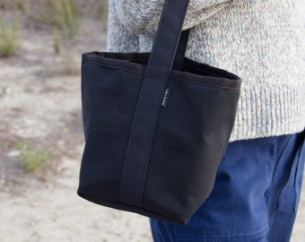 Reversible Small bucket style black canvas tote bag, 6 pockets