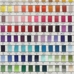 May include: A satin ribbon color card with a variety of colors, including white, ivory, and various shades of pink, red, blue, green, and brown. The card includes the text "Satin Ribbon Color Card" and "Wedding Welcome Bag".