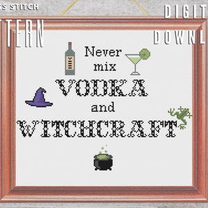 May include: Cross stitch pattern framed in a wooden frame. The design features the text "Never mix VODKA and WITCHCRAFT" with pixelated images of a bottle, cocktail, witch hat, frog, and cauldron. Digital download.