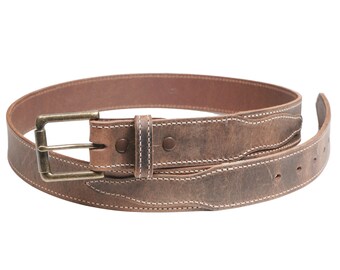 May include: A brown leather belt with a brass buckle and white stitching. The belt is rolled up and the buckle is visible.