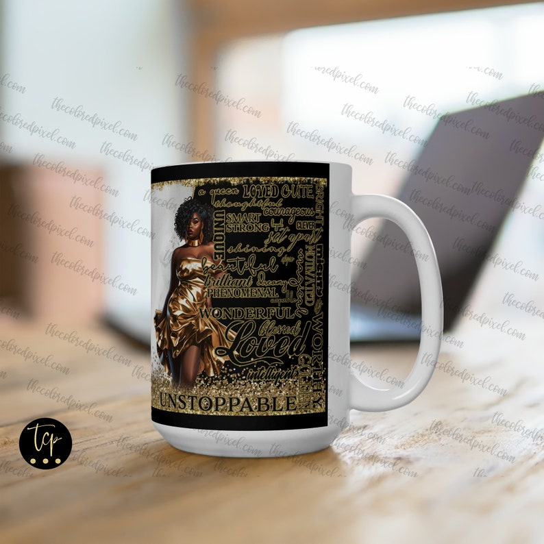 May include: A white ceramic mug with a black background and gold lettering. The mug features a black woman with gold hair wearing a gold dress. The text on the mug reads "A Queen Loved Cute Smart Courageous Unique Strong Blessed Phenomenal Wonderful Loved Intelligent Unstoppable".