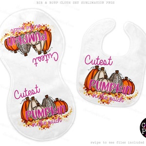 May include: A set of two white burp cloths with a fall-themed design. The design features a group of pumpkins with the text "Cutest Pumpkin in the Patch" in pink lettering.