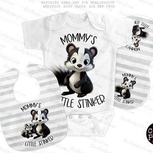 May include: A set of baby clothing featuring a black and white skunk with the text "Mommy's Little Stinker". The set includes a bodysuit, a bib, and a burp cloth. All items have a grey and white striped background.