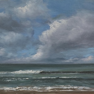 May include: An oil painting depicts a seascape with a dramatic sky. The sky is filled with large, textured clouds in shades of gray and white, with hints of blue. The ocean is a deep teal, with white waves breaking near the shore.