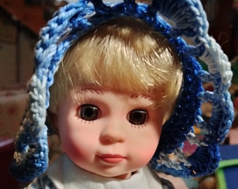 Crocheted blue and white bonnet and reticule