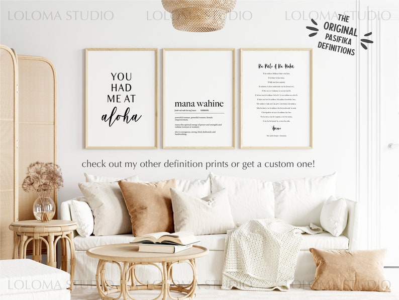 May include: Three framed prints with white backgrounds and black text. The prints are hanging on a white wall. The left print says "You had me at aloha". The middle print says "mana wahine" and has a definition below. The right print says "Ke Pele o Na Haku" and has a definition below. The prints are part of a collection called "The Original Pasifika Definitions".