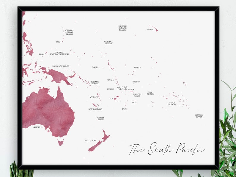 May include: A framed print showing a map of the South Pacific, rendered in a watercolour style with red and pink hues on a white backdrop. The map includes country names and the title "The South Pacific."