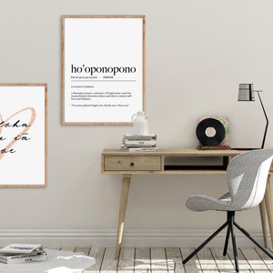 May include: Two framed prints with white backgrounds and black text. The print on the left features a pink heart with the text "Aloha au ia oe". The print on the right features the text "ho'oponopono" and its definition.
