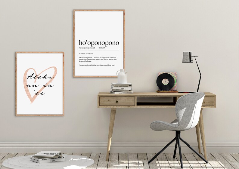 May include: Two framed prints with white backgrounds and black text. The print on the left features a pink heart with the text "Aloha au ia oe". The print on the right features the text "ho'oponopono" and its definition.
