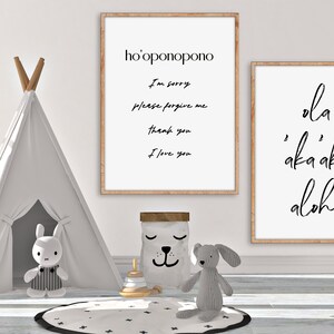 May include: Two framed prints with white backgrounds and black text. The print on the left says "ho'oponopono" and includes the text "I'm sorry, please forgive me, thank you, I love you". The print on the right says "ola akaaka aloha".