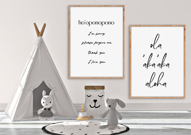 May include: Two framed prints with white backgrounds and black text. The print on the left says "ho'oponopono" and includes the text "I'm sorry, please forgive me, thank you, I love you". The print on the right says "ola akaaka aloha".