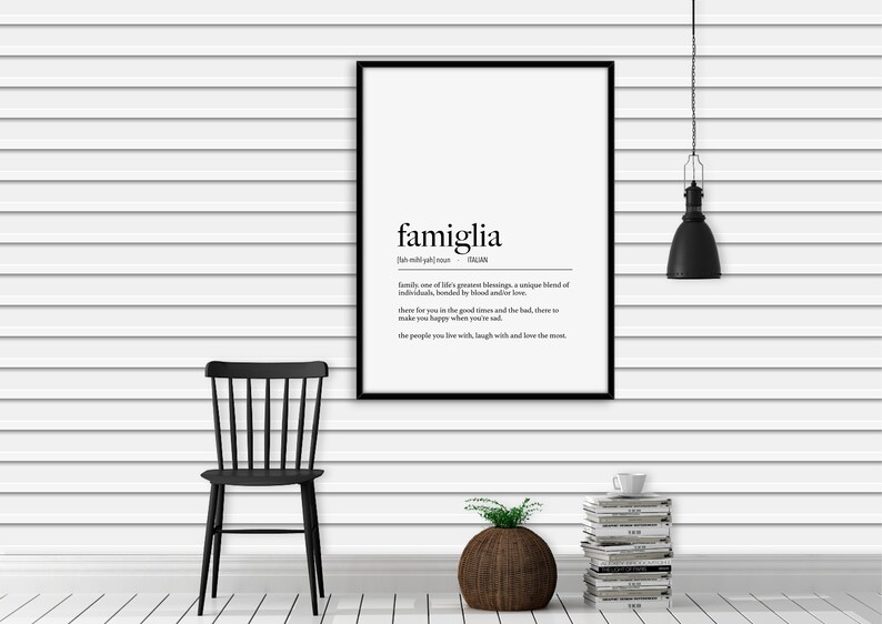 May include: Black and white print with the word "famiglia" in large letters, defined as "family, one of life's greatest blessings, a unique blend of individuals, bonded by blood and/or love..."