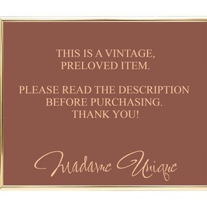 May include: A brown sign with gold trim, reading "This is a vintage, preloved item. Please read the description before purchasing. Thank you!" with the signature "Madame Unique" in cursive.