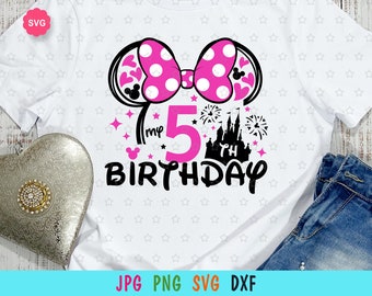 May include: A white t-shirt featuring a pink Minnie Mouse ears design, a pink bow, and the text "My 5th Birthday" with a black castle graphic.