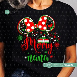 May include: A black t-shirt with a red and white bow, a green and red castle, and the text "Merry Nana" in green and red letters. The design is surrounded by green and red fireworks.