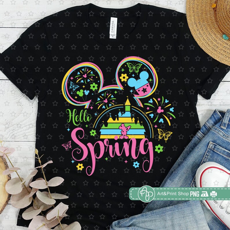 May include: Black t-shirt with a colorful Mickey Mouse head design. The design includes a castle, fireworks, and the text "Hello Spring".