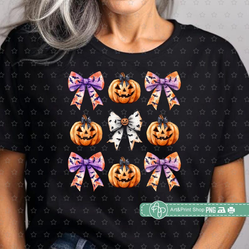 May include: A black t-shirt with a repeating pattern of orange pumpkins with purple and orange bows. The pumpkins have a jack-o-lantern face.
