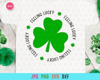 May include: A white t-shirt with a green shamrock and the text "Feeling Lucky" repeated around the shamrock.