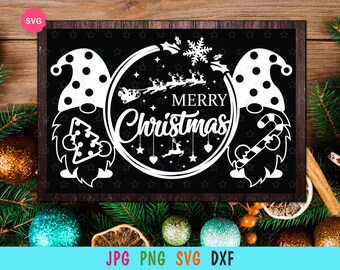 May include: Black and white digital design featuring two gnomes with a circle in the middle that says "Merry Christmas" with a Santa Claus and reindeer flying through the air. The design is on a black background with white stars.