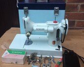 White Vintage Singer 221, 221K Portable Featherweight Sewing Machine with attachments.