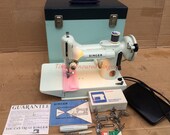 White Singer 221K Vintage Featherweight Sewing Machine with accessories and Instruction Manual