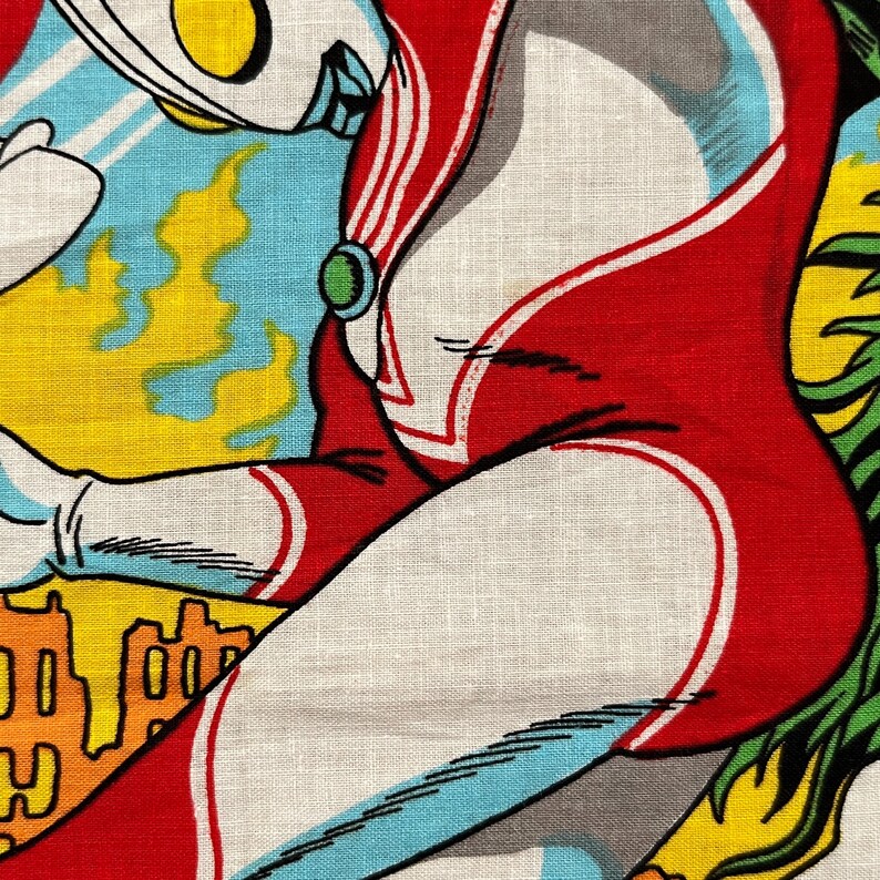 May include: A vibrant, retro-style illustration of a superhero figure in a red and white suit with a green gem. The artwork features a dynamic composition with yellow flames, blue sky, and a cityscape, evoking a sense of action and adventure.