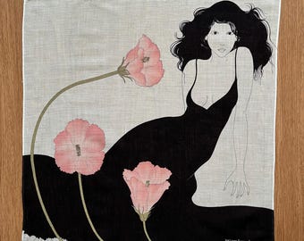 May include: Square handkerchief with a black dress design and pink flowers. The illustration features a woman with long black hair and a low-cut dress. The flowers have pink petals and green stems. The artist's signature is in the bottom right corner.