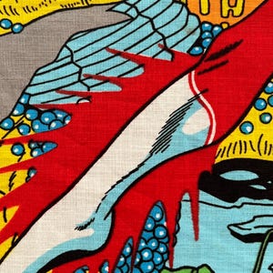 May include: Close-up of a colorful comic book panel. The image features bold colors and graphic elements, including red, blue, yellow, and white. The design includes abstract shapes and patterns, with a vintage aesthetic.