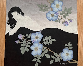 May include: Square scarf with a black and gray background, featuring a reclining figure and floral branches with blue flowers. The scarf has a signature in the bottom right corner.