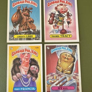 Topps - Garbage Pail Kids - Liberty Libby 113b, Trashed Tracy 129b, Foxy Francis 133b, Hy Rye 143b - Lote de (4) - Vintage - Anos 80