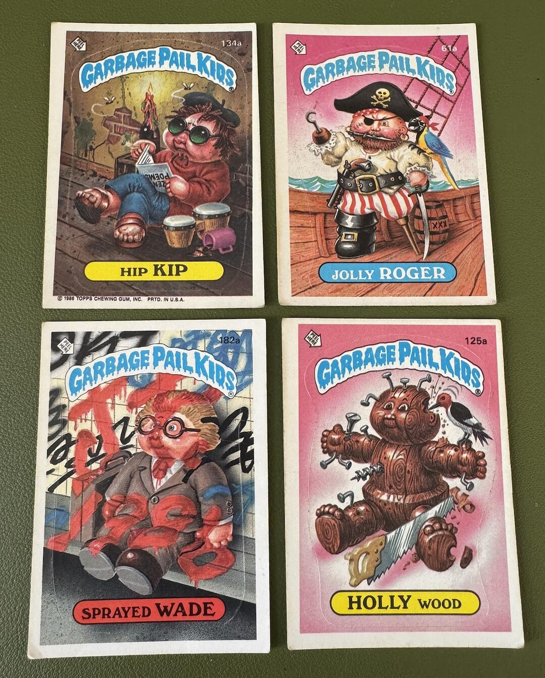 Topps - Garbage Pail Kids - Hip Kip 134a, Jolly Roger 61a, Sprayed