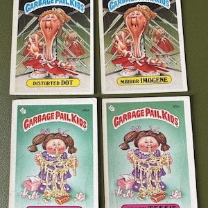 May include: Four Garbage Pail Kids trading cards. The cards feature illustrations of children with exaggerated features and humorous situations. The cards are numbered 96a, 96b, 45a, and 45b. The names of the characters are Distorted Dot, Mirror Imogene, Leaky Lindsay, and Messy Tessie.