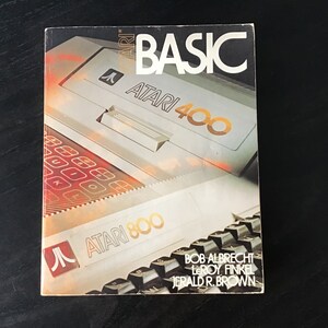 May include: A book titled "Atari BASIC" with a picture of an Atari 400 and Atari 800 computer on the cover. The book is written by Bob Albrecht, Leroy Finkel, and Jerald R. Brown.