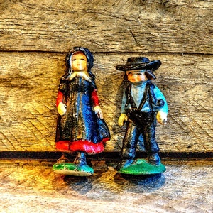 Vintage cast iron Amish farming couple