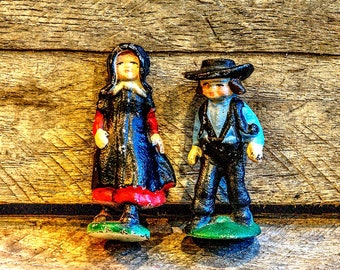 Vintage cast iron Amish farming couple